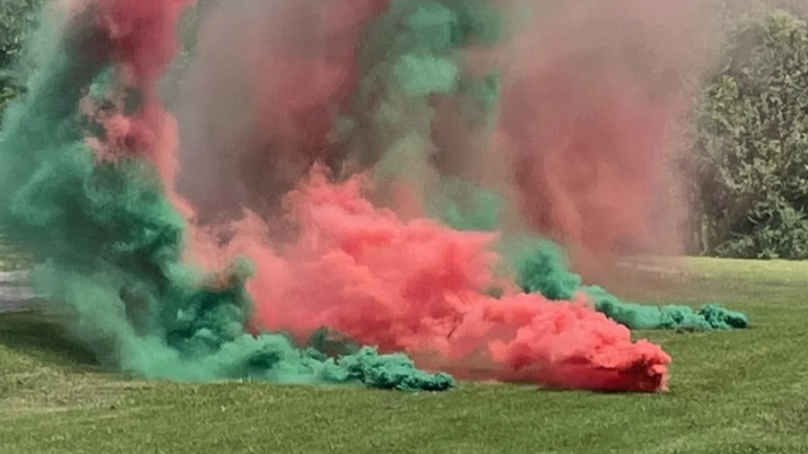 Red and green pyrotechnic smoke during an HFI Pyrotechnics demonstration