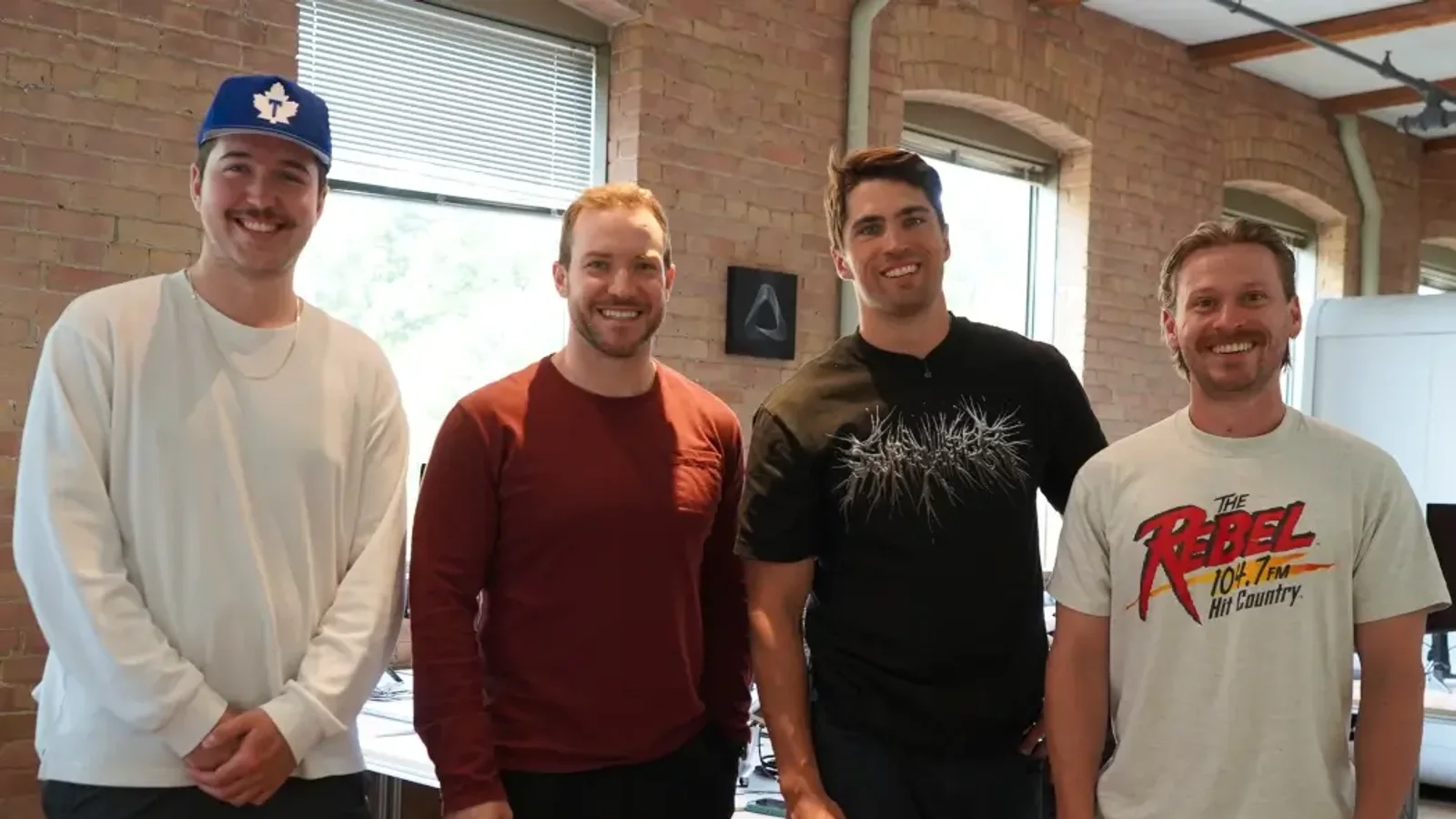 Four members of the Superwhisper team in an office